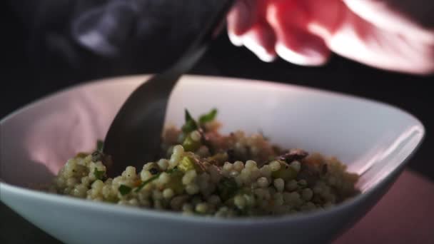 Man Leaving Spoon Steamy Plate Vegetarian Couscous — стоковое видео