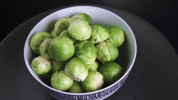 Fresh Wet Brussel Sprouts Rotating Black Background — Stock video
