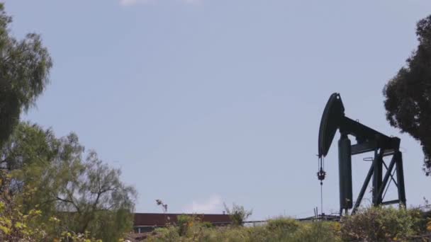 Distant Oil Pump Sunny Day — Stock videók