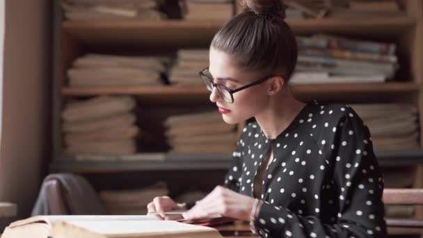 Woman Looks Book While Making Notes Library — Stock videók