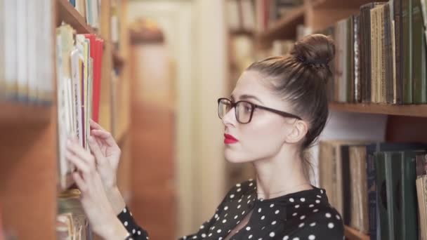 Woman Looking Book Library — Stockvideo