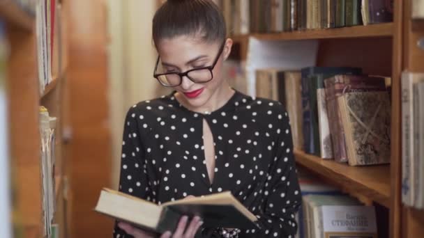 Woman Flicking Pages Book Library — Stockvideo