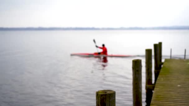 Rower Cold Danish Lake Red Kajak Drives Pier Slow Motion — Stockvideo