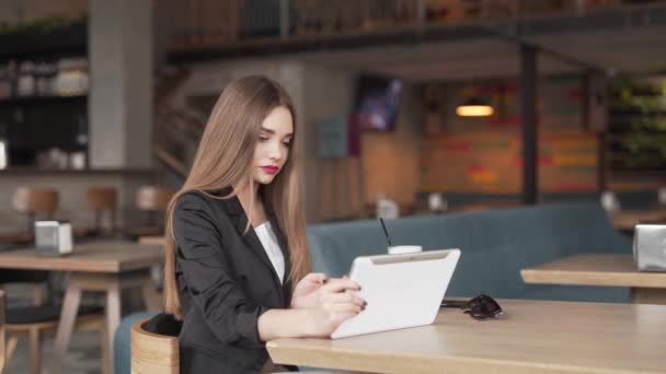 Young Businesswoman Uses Her Tablet Device Talk Video Conference Call — Video