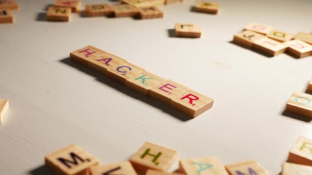 Someone Writing Hacker Wooden Tiles Letters White Background Dramatic Light — Stock Video