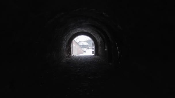 Walking Slowly Dark Black Tunnel Entrance Shining Brightly Distance — Stock Video