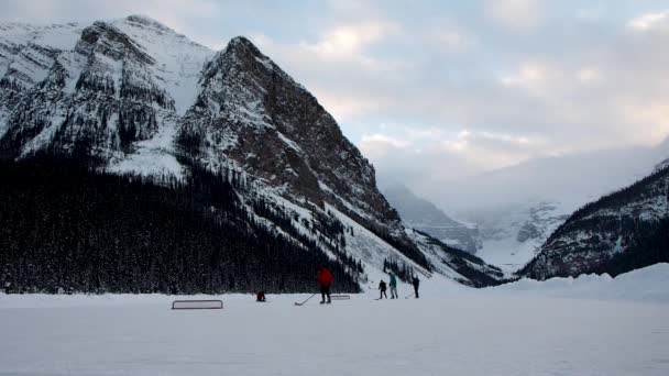 Playing Hockey Frozen Lake Mountains Background — Video Stock
