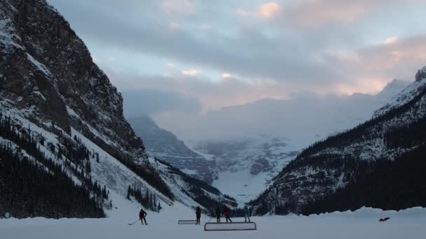 Playing Hockey Frozen Lake Mountains Background — Stock videók