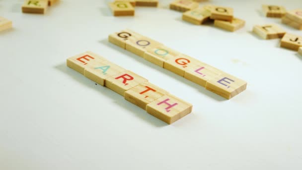 Someone Spelling Google Earth Wooden Letters Table Other Scattered Wooden — Stockvideo