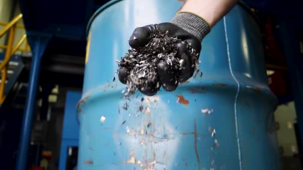 Gloved Hand Drops Metal Turnings Bucket — Stock Video