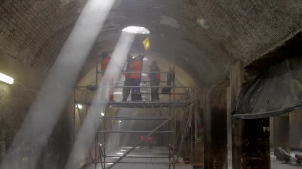 Workers Scrapping Ceiling Surface Old Water Reservoir — Stock Video