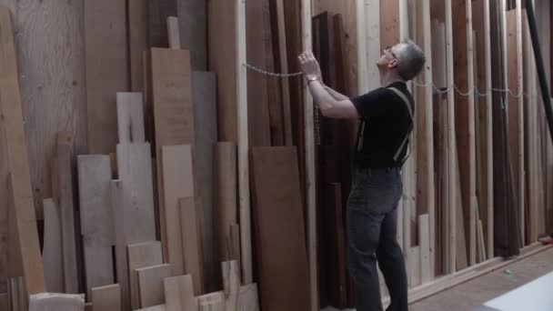 Woodworker Selecting Rough Lumber Storage Rack Wood Work Shop — Stock Video