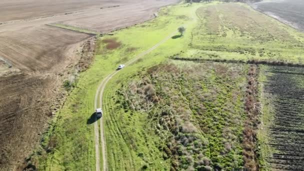 Drone Shot Chasing Tow Cars Crossing Farmland Sandy Road Istanbul — Stock Video