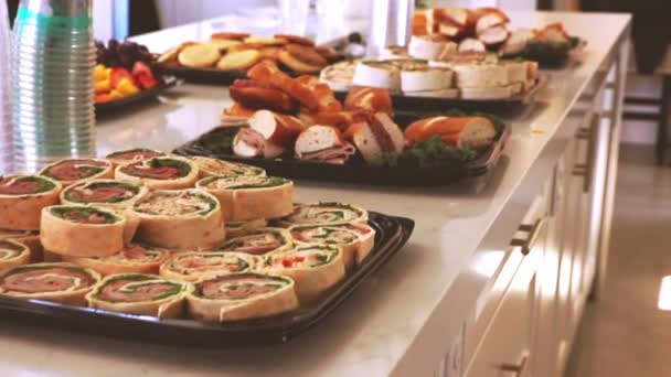 Closeup Catered Food Buffet Sandwiches Roll Ups Cookies Drinks Party — Stock Video