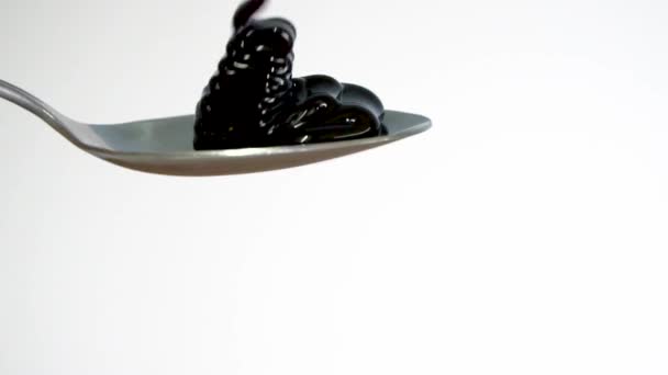 Molasses Fills Spoon Overflows Slow Motion Close — Stock Video
