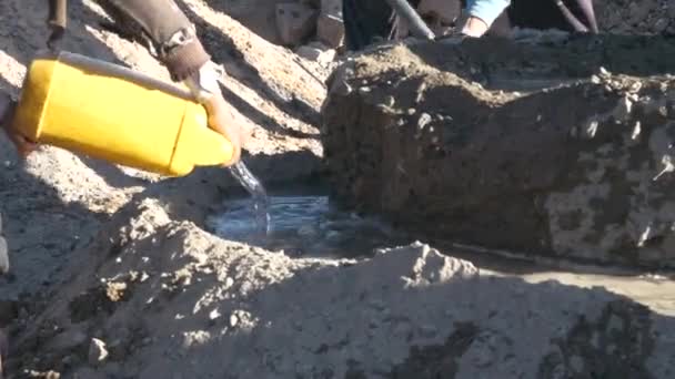 While Builder Working Pouring Water Mix Cement Old Fashion — Stock Video