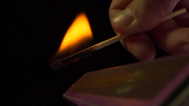 Slow Motion Match Burns Fingertips Blows Out — Stock Video