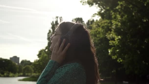Attractive Young Italian Woman Headphones Listening Music Park Sunset Look — Stock Video