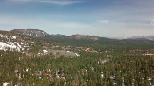 Aerial Shot High Altitude Mountain Village Nestled Foot Snow Capped — Stock Video