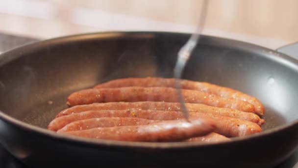 Thin Brown Pork Sausages Cooking Frying Pan Electric Stove Top — Stock Video