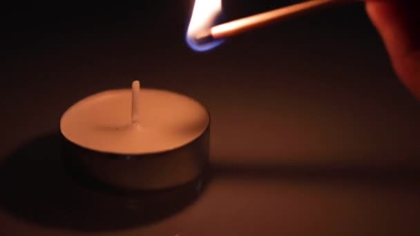 Small Candle Being Lit Match Close Shot — Stock Video