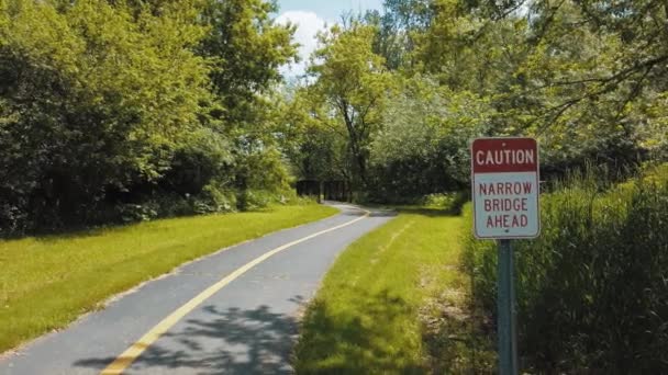 Beautiful Bike Path Leads Narrow Bridge Small Creek Sign Narrow — Stock Video