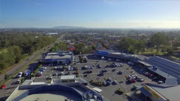 Aerial Drone Shot Moving Local Shopping Centre Busy Arterial Road — Stock Video