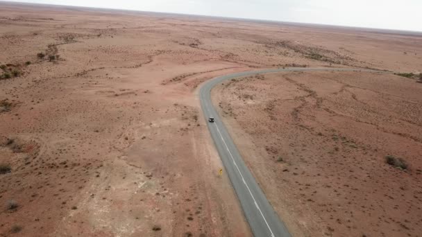 Aerial Drone Shot Tracking Vehicle Driving Empty Road Australian Outback — Stock Video