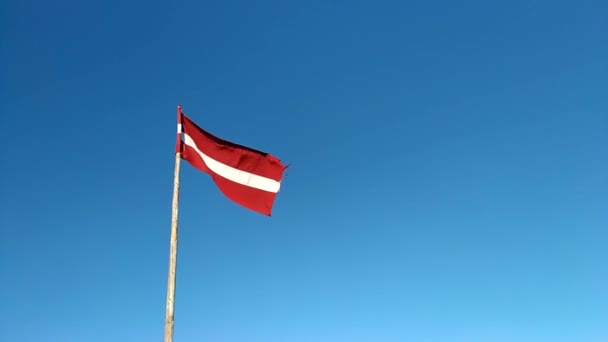 Latvian Flag Bright Blue Sky Slow Motion Medium Shot — Stock Video