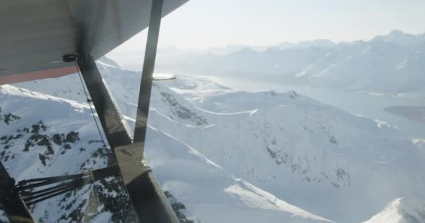 Aerial Small Airplane Overlooking Snowy Mountain Ocean — Stock Video