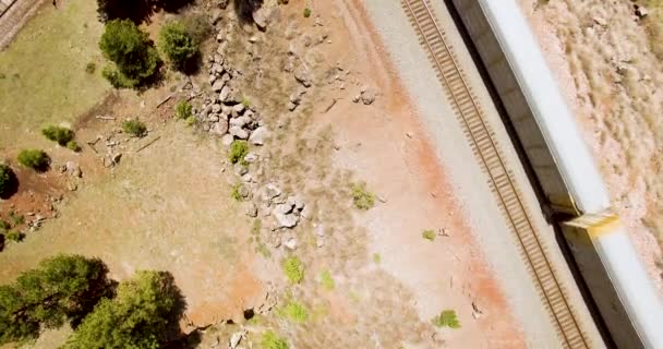 Aerial Overhead Footage Railroad Cars Pass Slowly Drone Concept Southwestern — Stock Video