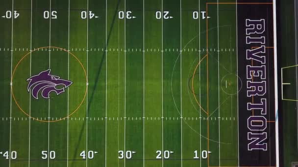 Drone Shot Empty High School Football Field Track Going Bleachers — Stock Video