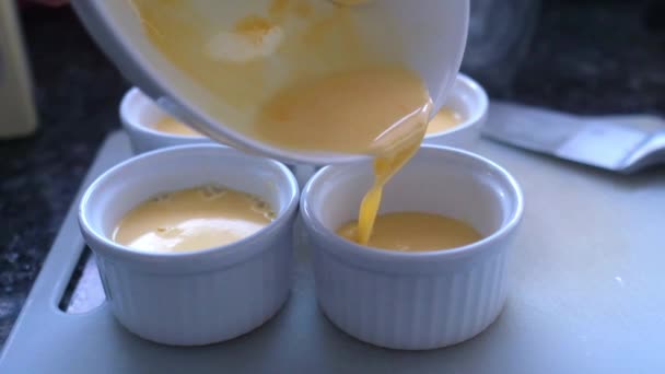 Making French Dessert Cream Brulee Pouring Mixture Little Bowl Slow — Stock Video