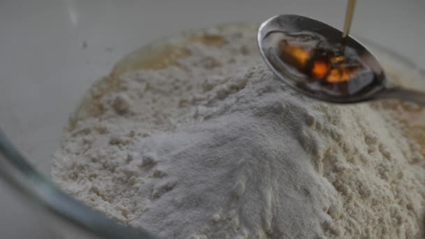 Person Pouring Vanilla Essence Metallic Spoon Sprinkling Flour Baking Mix — Stock Video