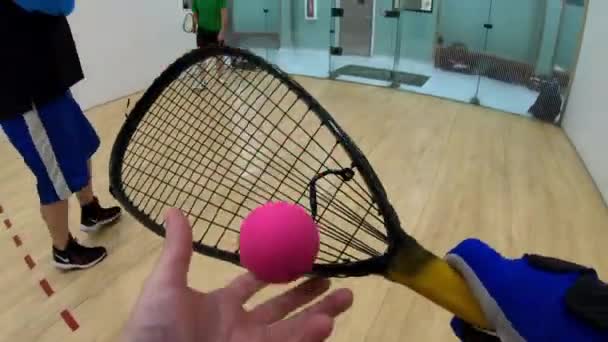 Man Cut Throat Racquetball Fpv Player Scoops Ball Racket Bounces — Stock Video