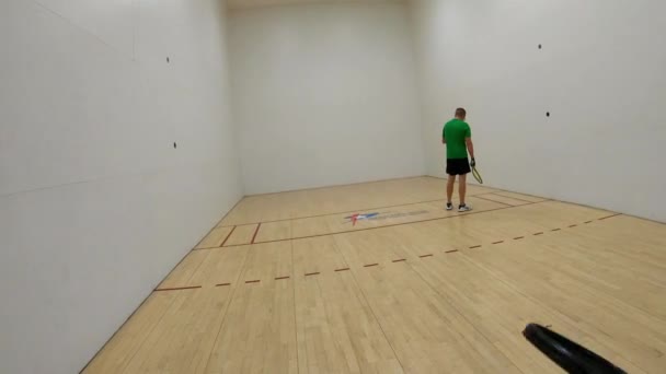 Man Cut Throat Racquetball Player Serves Returned Him Being Able — Stock Video