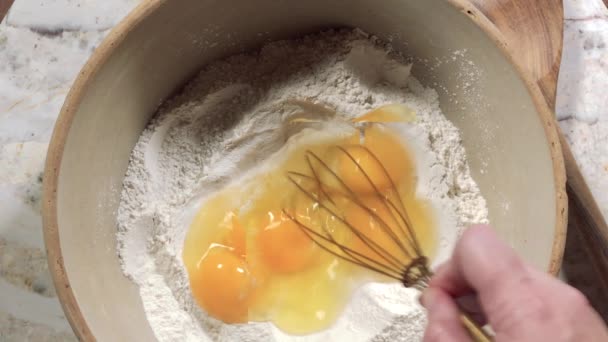 Overhead View Whisking Eggs Flour Large Mixing Bowl — Stock Video