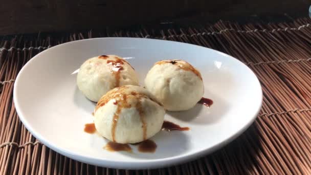 Finishing Plated Steamed Buns Adding Black Sesame Seeds Green Onions — Stock Video