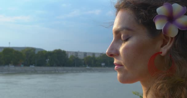 Close Profile Young Female Opening Eyes Meditation River Sunny Eevening — стоковое видео