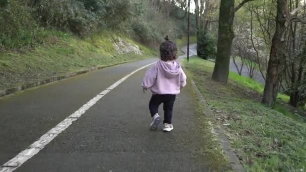 Back View Toddler Running Laughing Looking Camera Tracking Shot — Stock Video