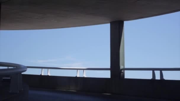 Driving Spiral Parking Garage Blue Skies — Stock Video