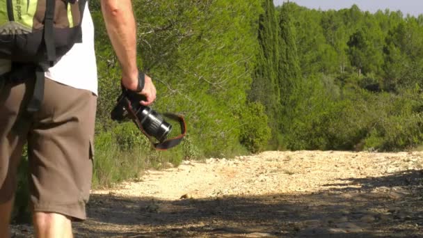 Man Camera Walking Hiking Trail Slow Motion Low Angle — Stock Video