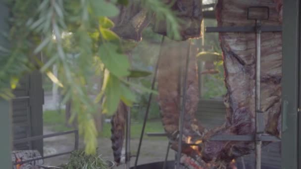 Slow Motion Handheld Shot Raw Meat Asado Being Cooked Smoke — Stock Video