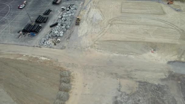 Aerial View Contruction Site Trackers Bolders Standing Crossroad Car Parking — Stock Video