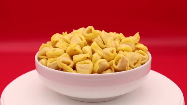 Raw Tortellini Rotating Red Background Traditional Italian Pasta — Stock Video