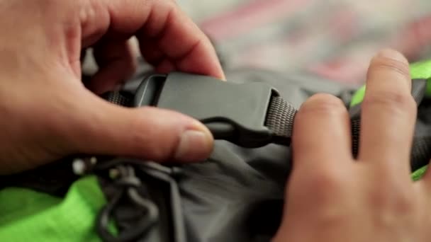 Close Person Hands Undoing Rucksack Buckle — Stock Video