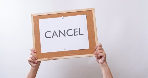 Woman Hand Shows Paper Board Word Cancel White Studio Background — ストック動画