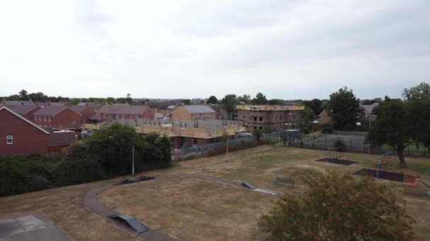 Drone Approaching Building Development Site Whilst Passing Tree Park Medium — Stock Video