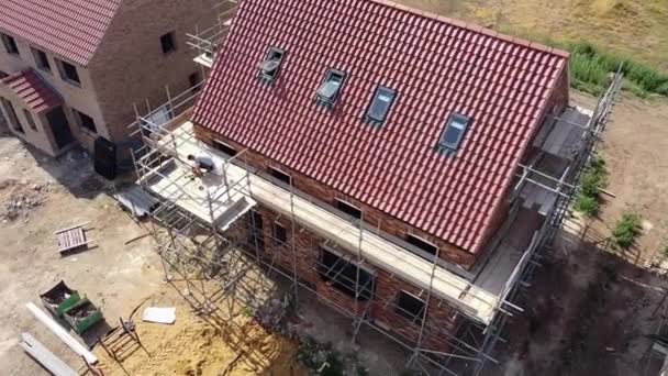 Rotating Aerial View Scaffolded New Build House Construction Showing Front — Stock Video