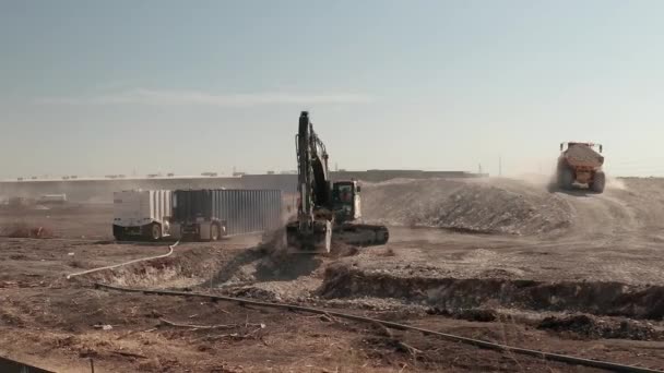 Push Shot Construction Site Crawler Excavator Dump Truck Moving Dirt — Stock Video